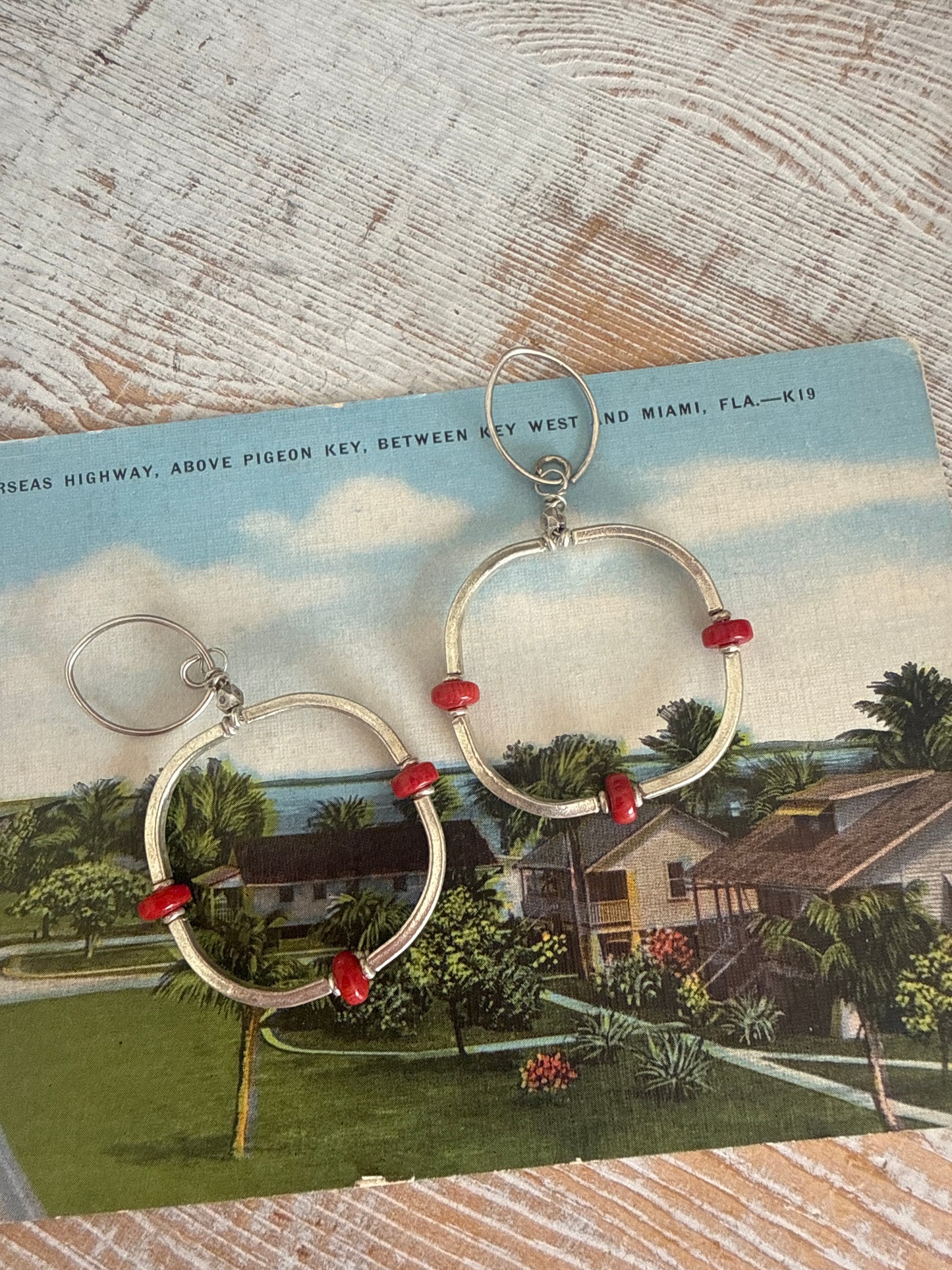 Segmented hoops of fine silver with broom coral accents earrings.