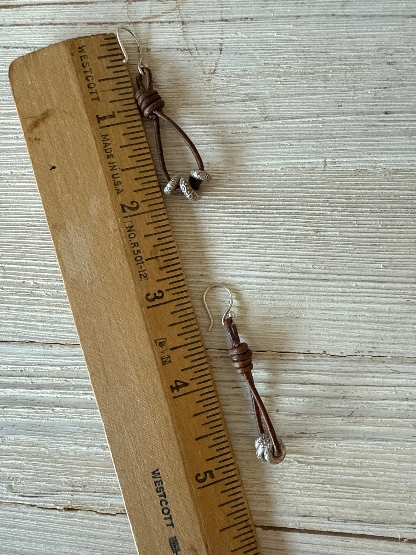 Leather and fine silver earrings.