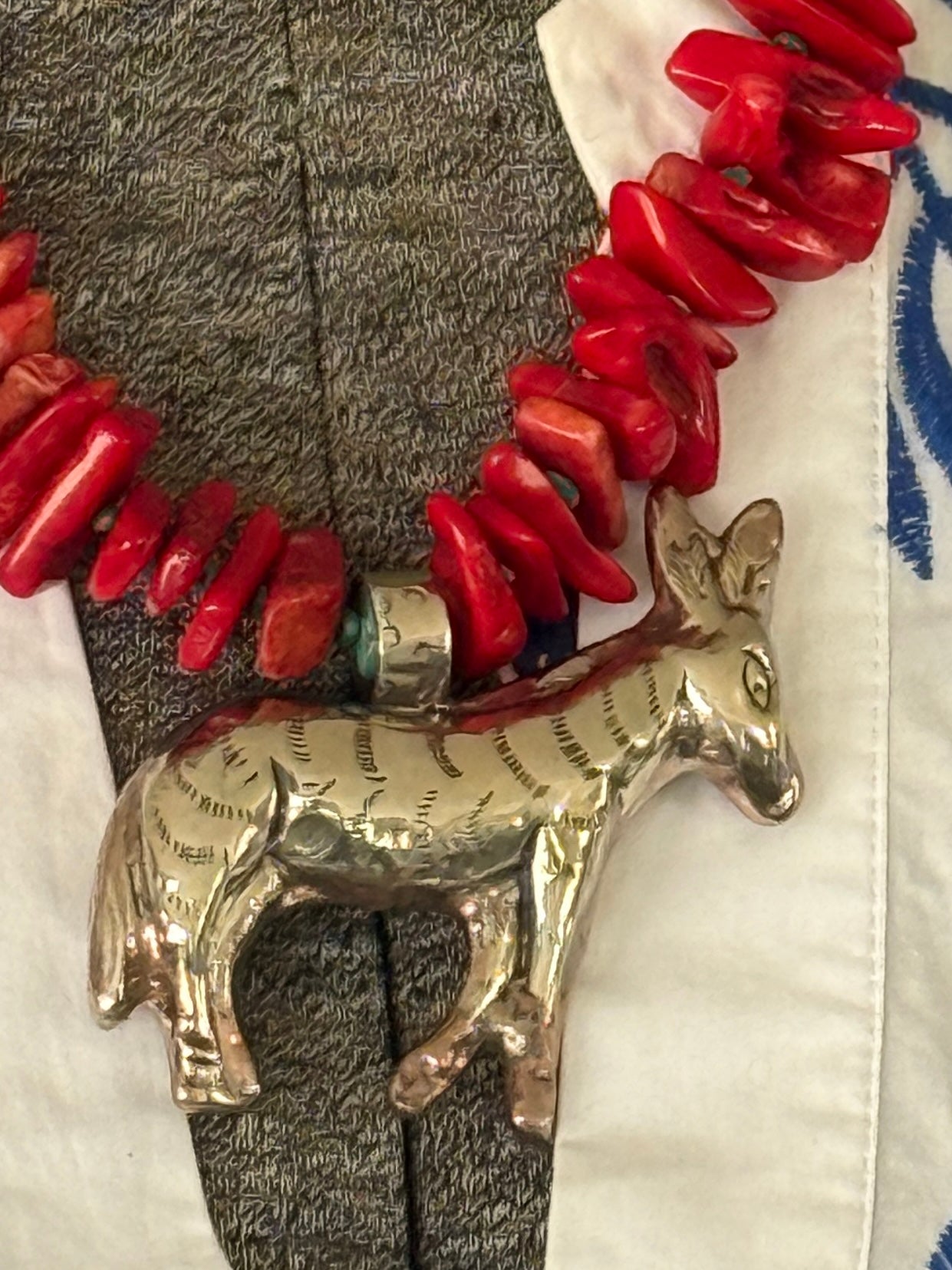 Fun red broom coral and turquoise necklace with donkey pendant. 18.5-23”