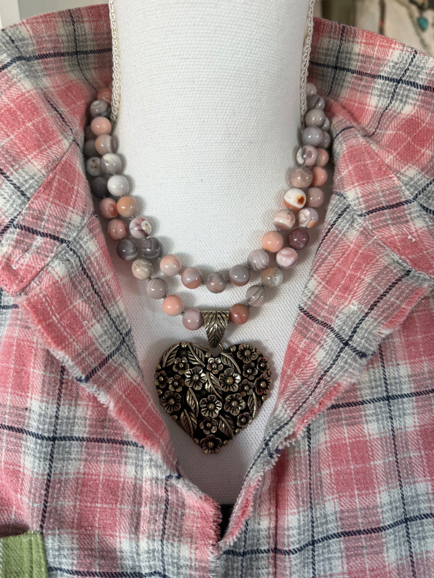 Tibetan flowered heart pendant on pink Botswana agates long necklace.