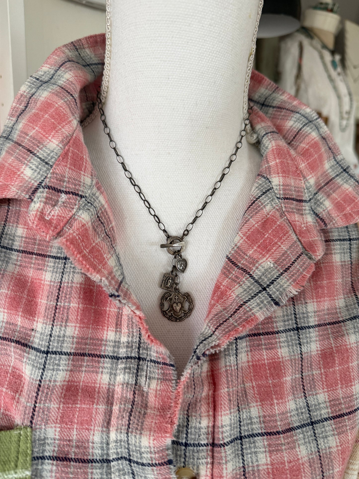Oxidized sterling silver chain with sterling silver religious medals and fine silver front toggle necklace.
