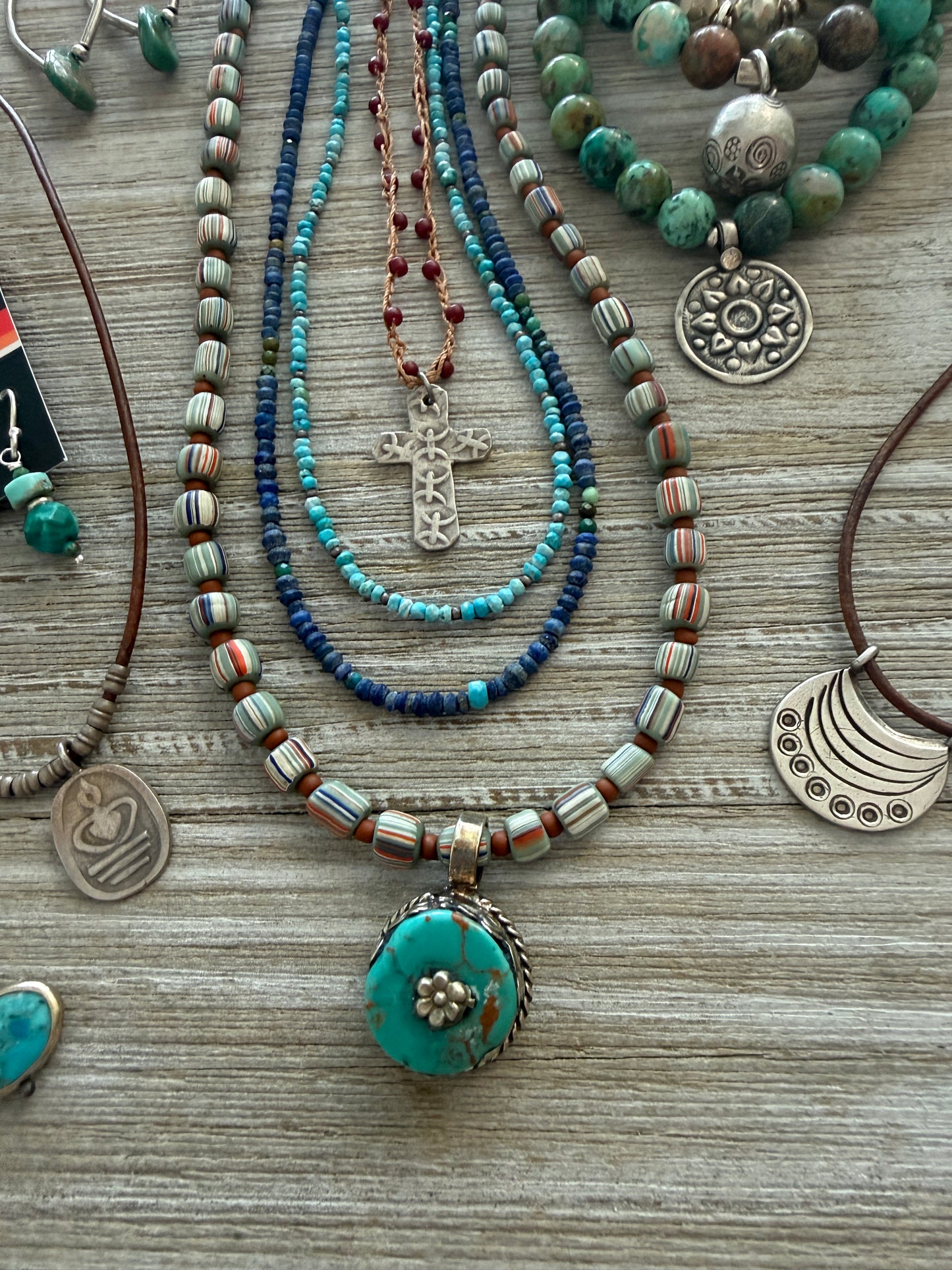 Tibetan turquoise pendant on striped Java beads. Fine silver hook clasp. 21”.