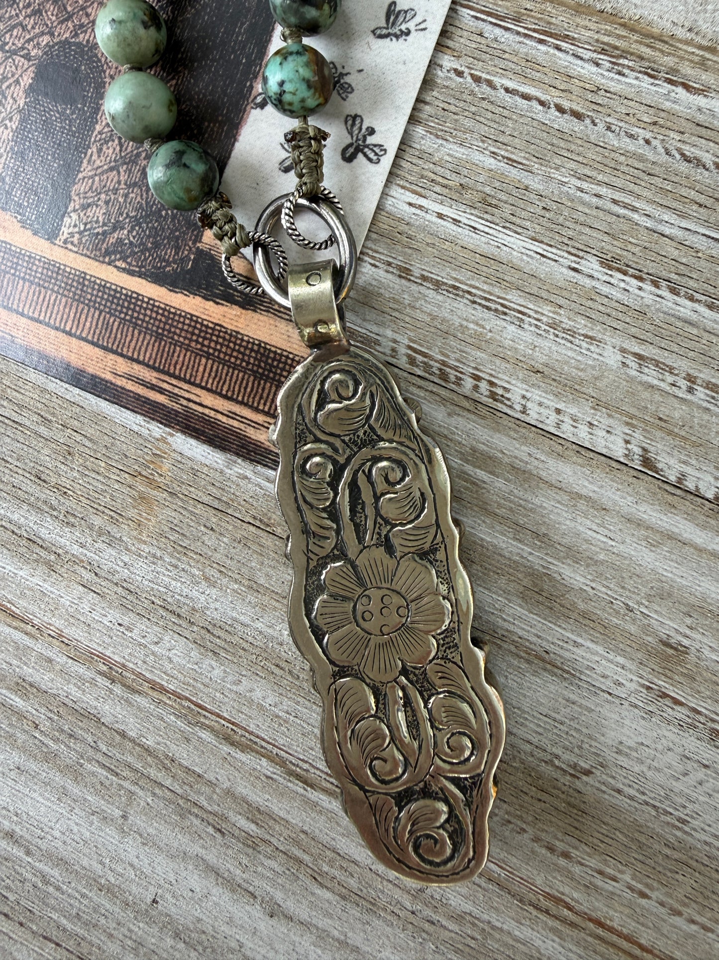 Green turquoise knotted necklace with Tibetan turquoise (removable) pendant. 34.25”.