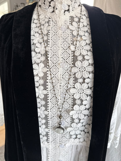 Antiqued bronze glass locket on pyrite chain. 32”