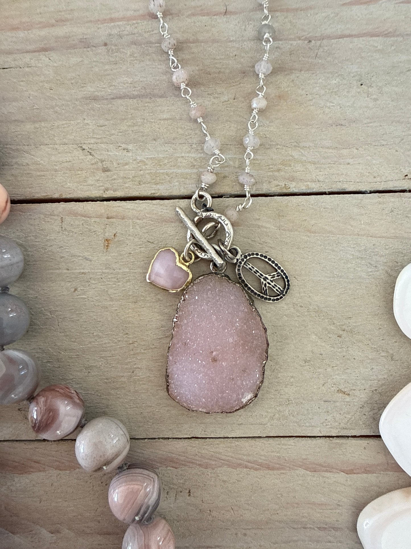 Pink druzie on rose quartz chain. Sterling peace sign and opal heart charm necklace.