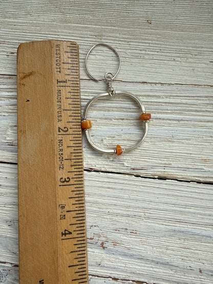 Segmented hoops of fine silver with broom coral accents earrings.