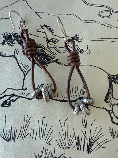 Leather and fine silver earrings.