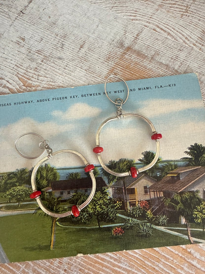 Segmented hoops of fine silver with broom coral accents earrings.