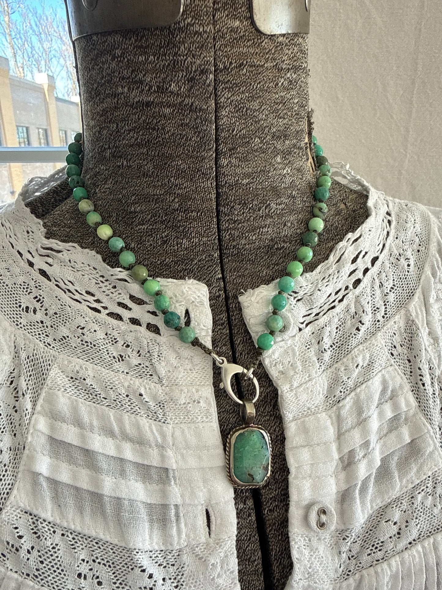 Knotted chrysocolla with sterling silver charm holder clasp and chrysocolla pendant necklace. 17”