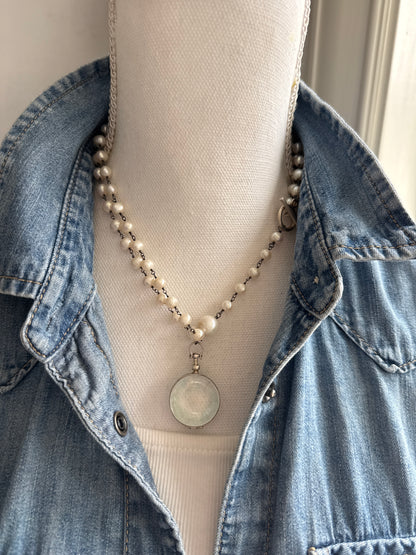 Pearl and sterling locket Y necklace.