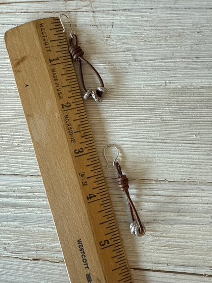 Leather and fine silver earrings.