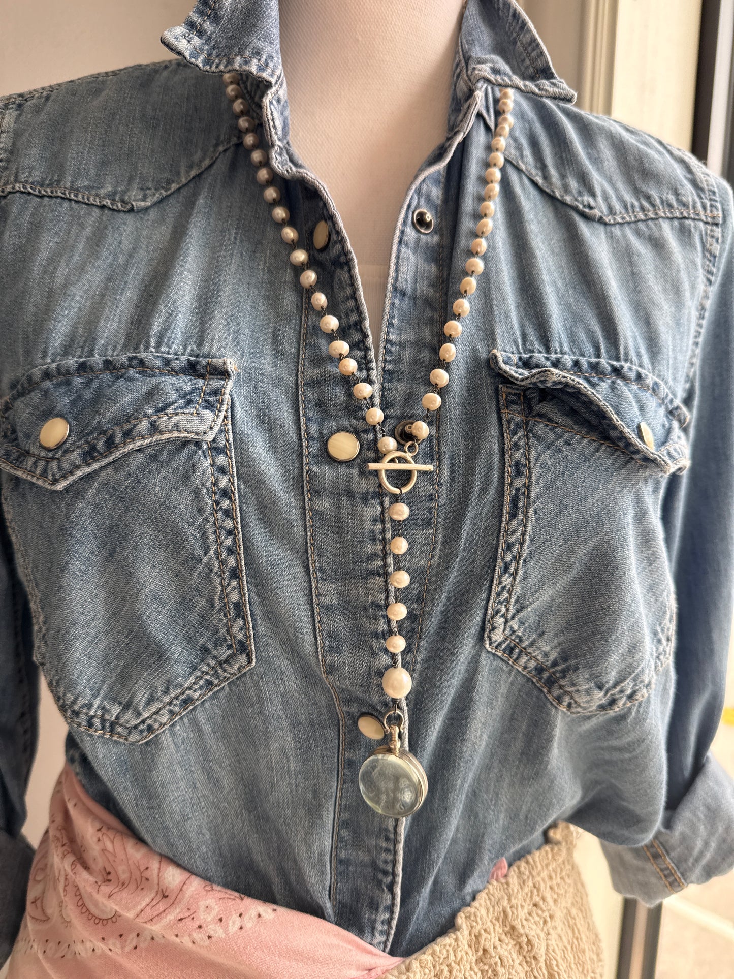 Pearl and sterling locket Y necklace.