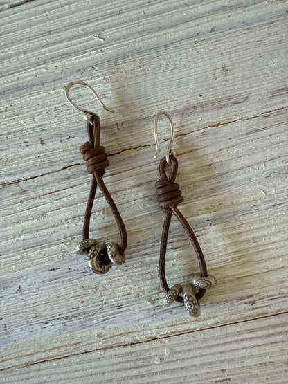 Leather and fine silver earrings.