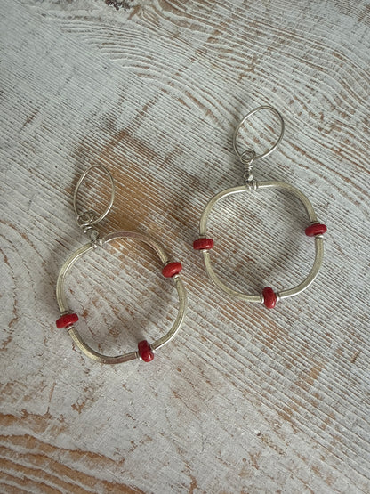 Segmented hoops of fine silver with broom coral accents earrings.