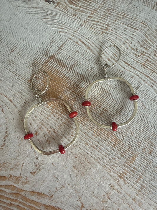 Segmented hoops of fine silver with broom coral accents earrings.