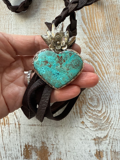 Tibetan turquoise heart on braided deerskin leather necklace. 32”.