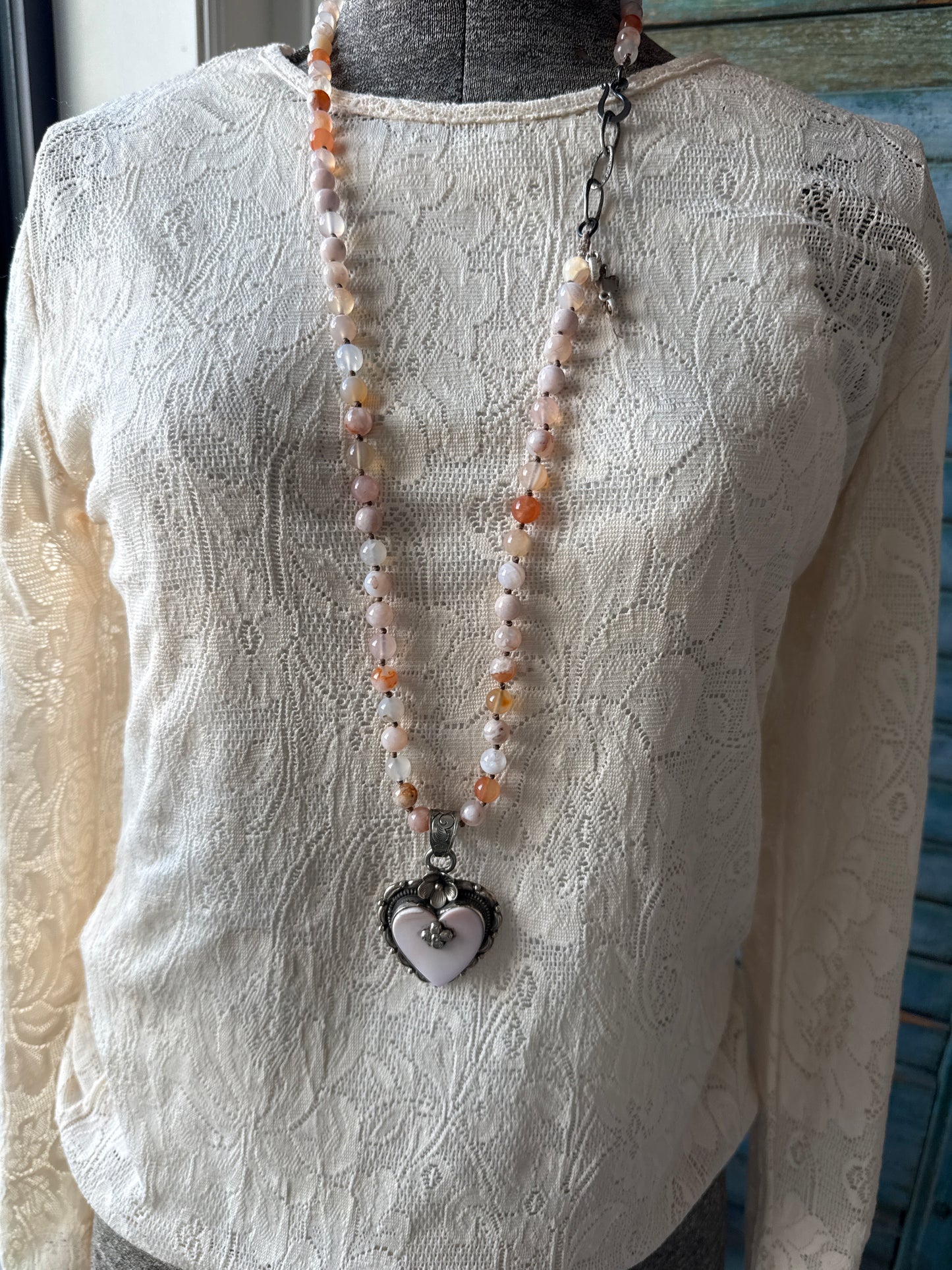 Cherry blossom agates hand knotted necklace with Peruvian Opal Tibetan heart pendant. 32.5-35.5”.