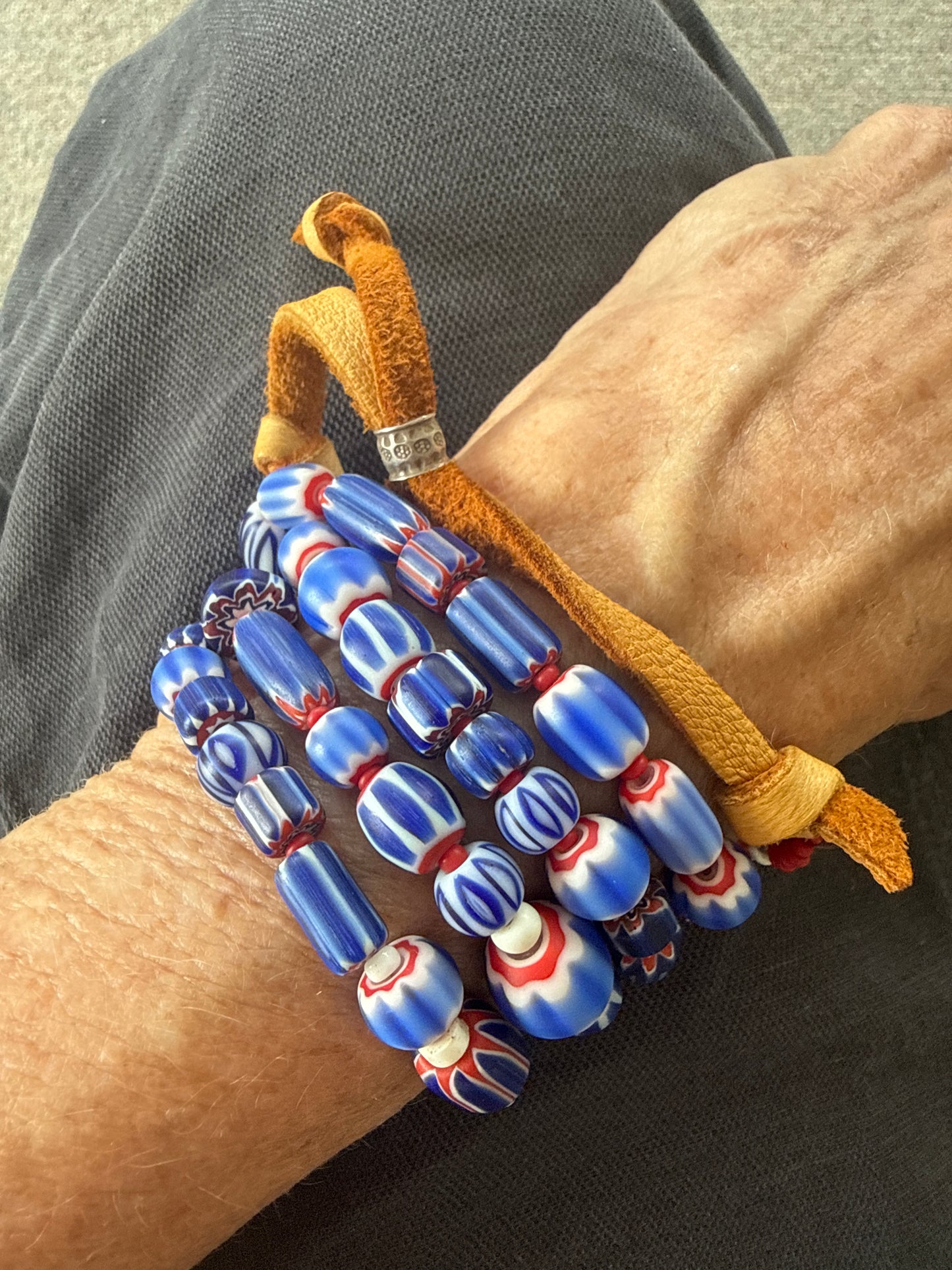 Blue, red, and white tribal chevron beads on leather adjustable necklace. 36”