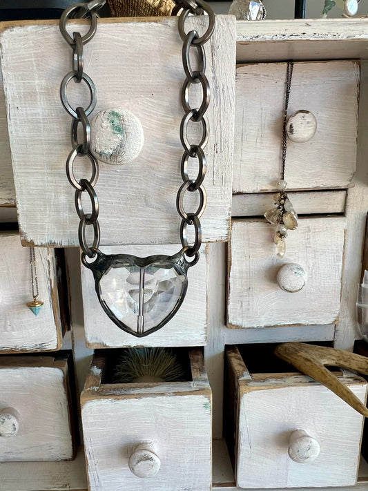 Faceted, clear glass heart on chunky gunmetal chain necklace.