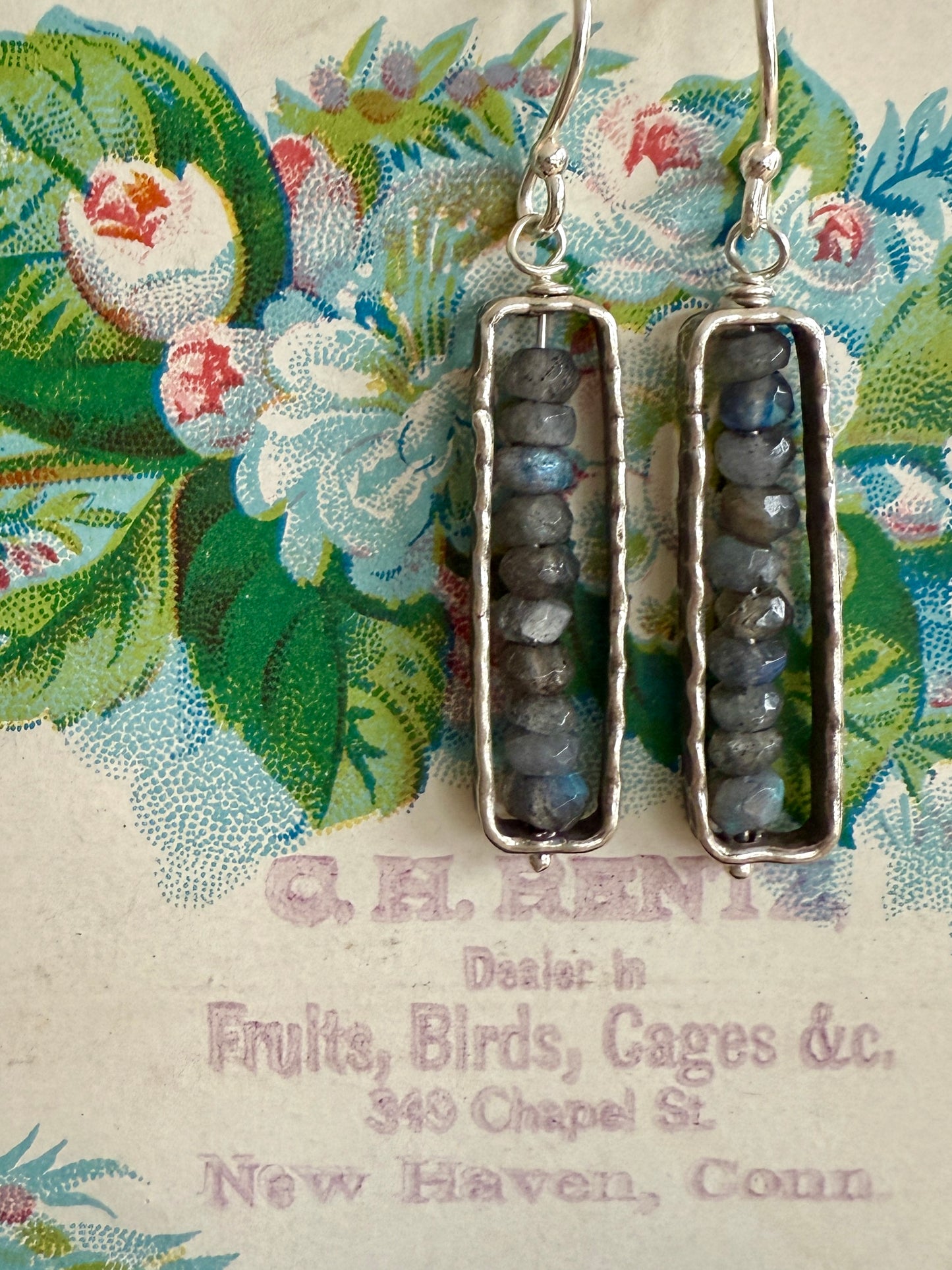 Labradorite in fine silver frames on fine silver ear wires. Earrings.