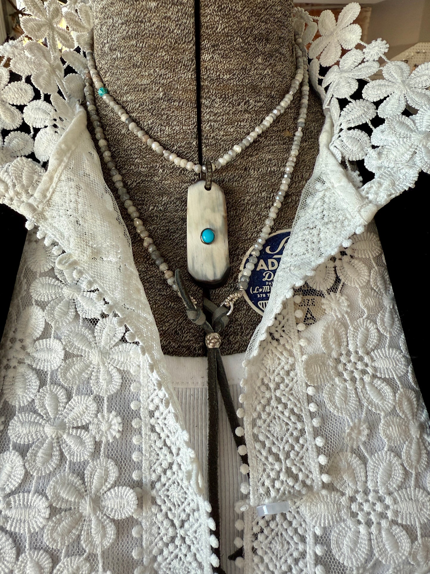 Creamy grey bone pendant with turquoise inlay and diamond bale on silverite and fine silver adjustable necklace.