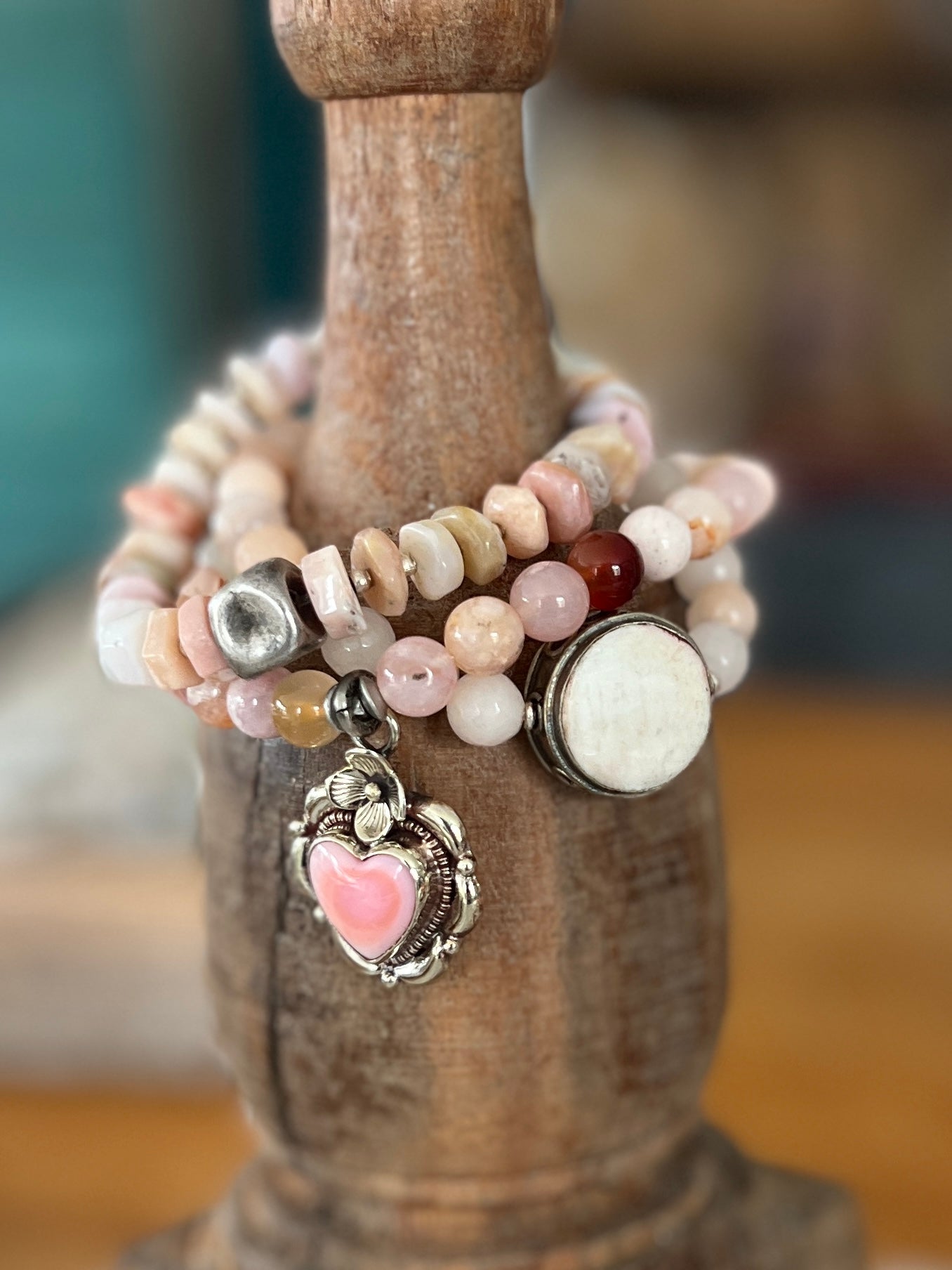 Tibetan silver Peruvian Opal heart charm on cherry blossom agates. Stretch stack bracelet. 7”.