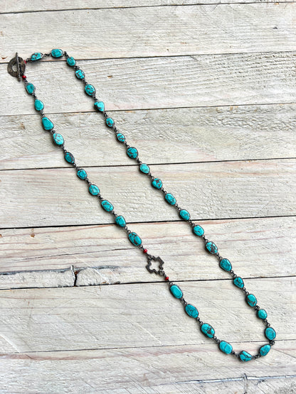 Gorgeous turquoise chain with hand made sterling open cross and toggle. 29”.