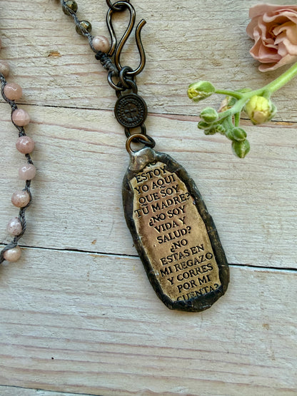 Our Lady of Guadeloupe pendant on knotted sunstone necklace.