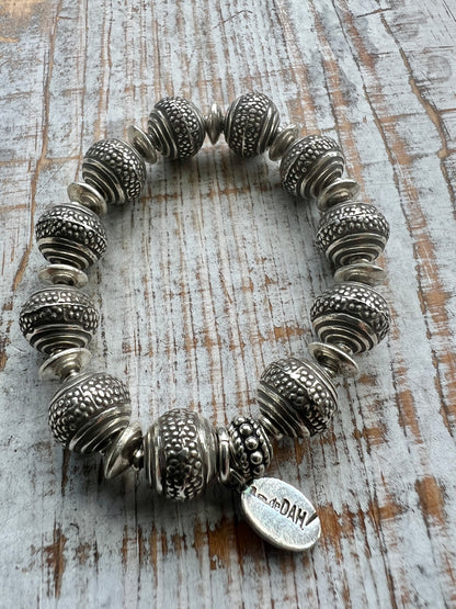 Fun, textured fine silver rounds stretch bracelet. Small (6”)