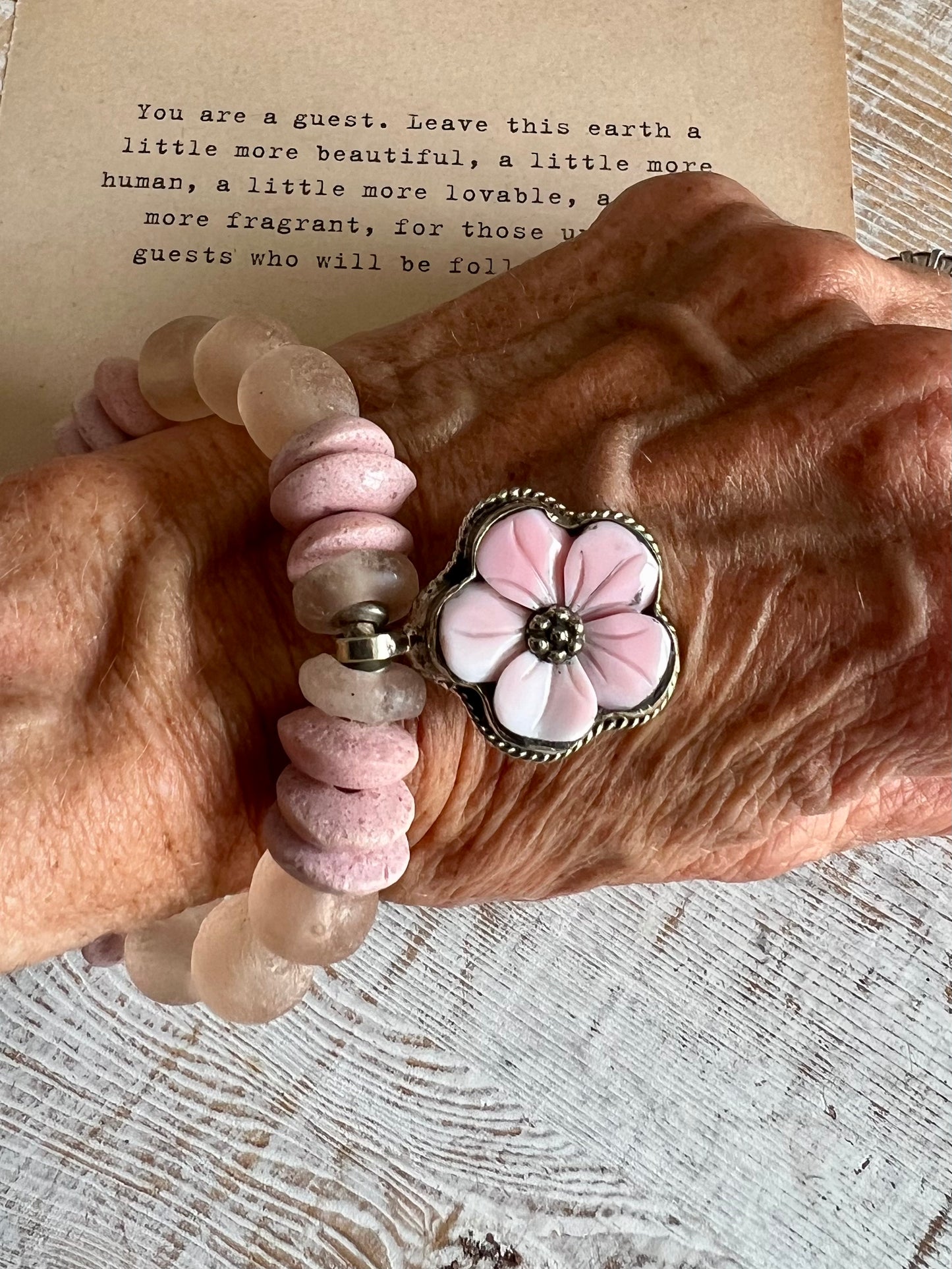 Tibetan carved Peruvian Opal flower on Ethiopian glass beads. Chunky stack bracelet. 7.5”