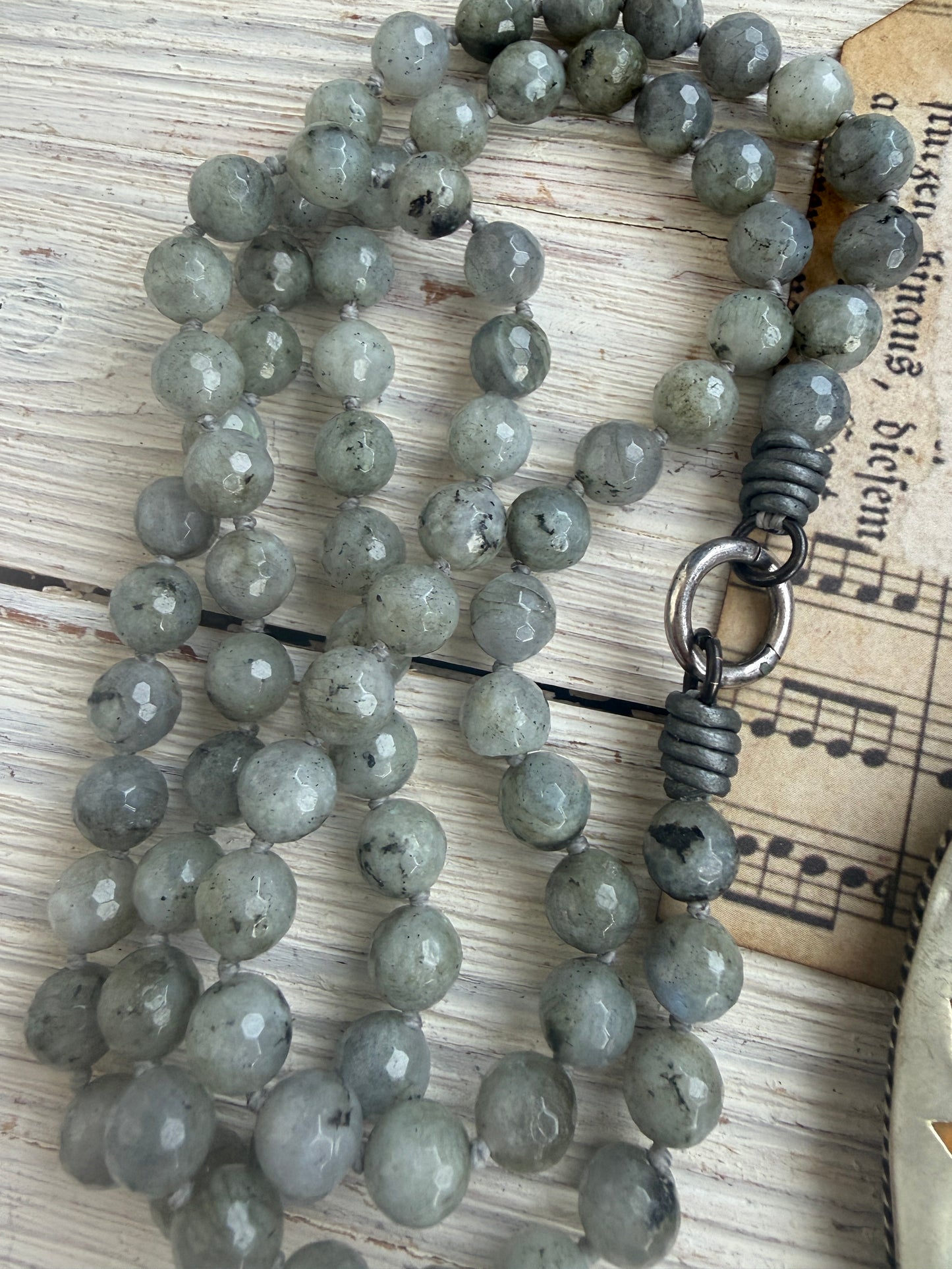 Tibetan bumblebee jasper pendant on knotted grey labradorite necklace. 33” long.