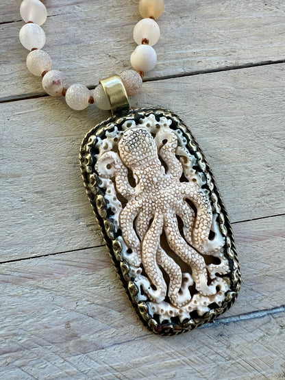 Carved bone octopus on hand-knotted druzy agates.  39” necklace. Wear long or short.