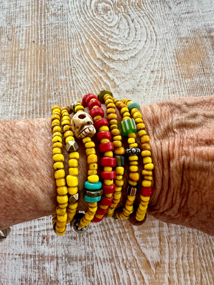 Maize glass bead stack of 7 bracelets.