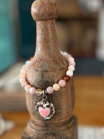 Tibetan silver Peruvian Opal heart charm on cherry blossom agates. Stretch stack bracelet. 7”.