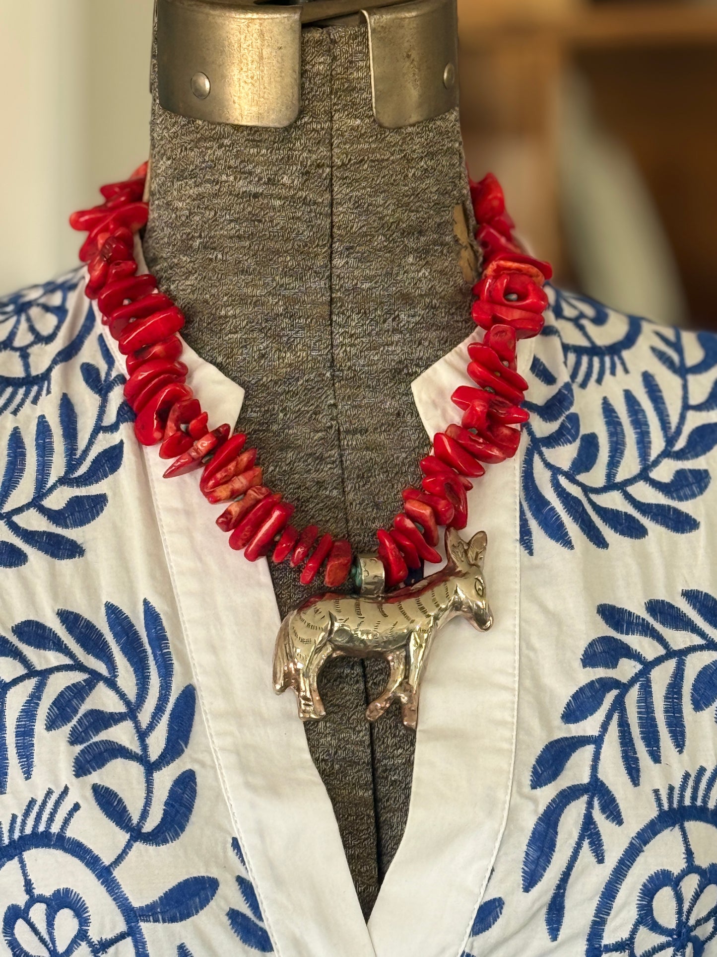 Fun red broom coral and turquoise necklace with donkey pendant. 18.5-23”