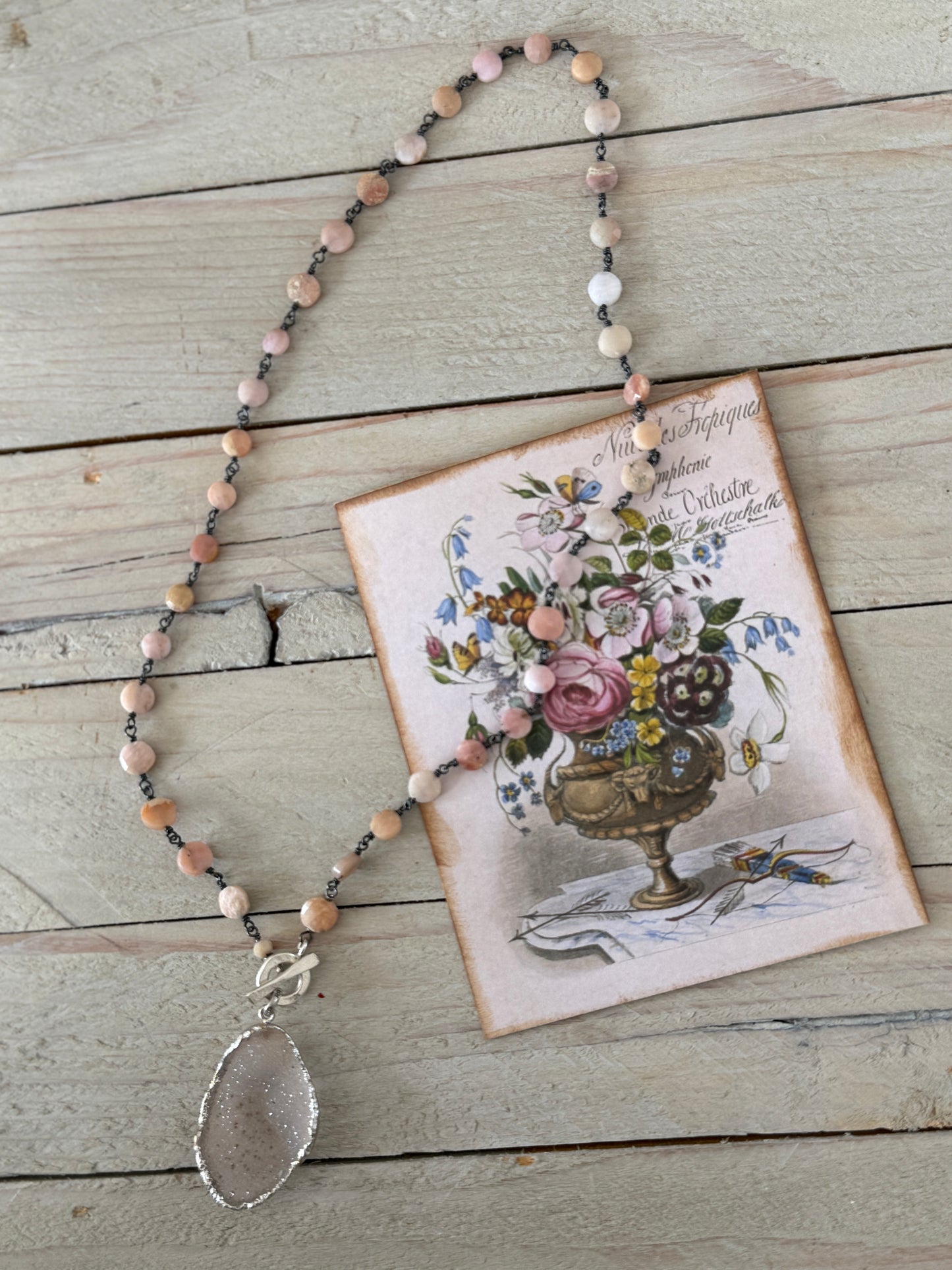 Pale pink druzie on pink Peruvian Opal wire-wrapped coins. Front fine silver toggle necklace.