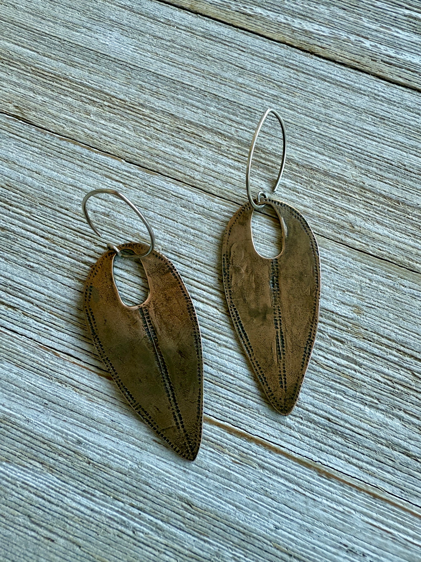 Handmade hammered bronze tribal earrings on pure silver ear wires.