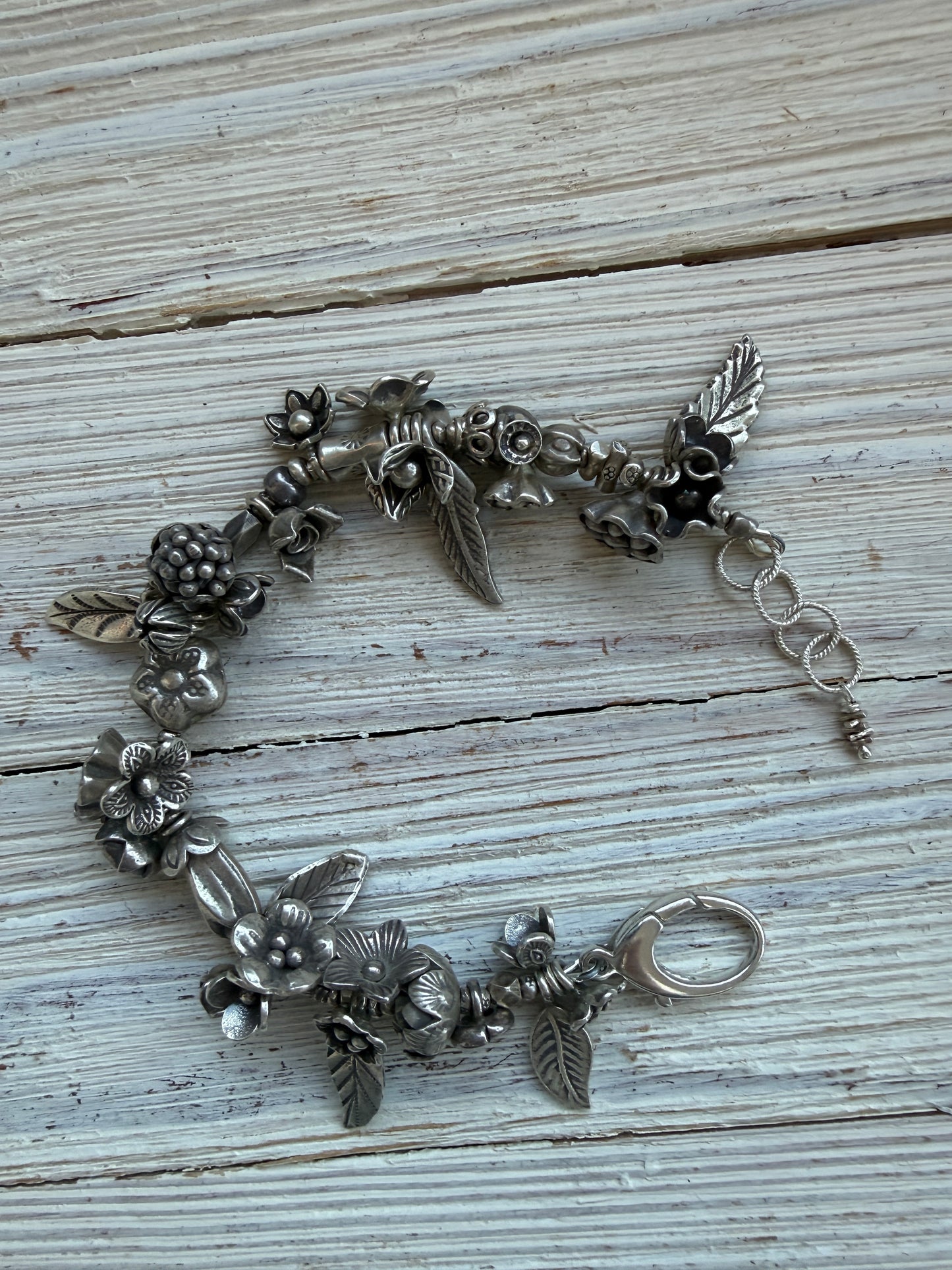 Fine silver leaves and flowers bracelet 7-8”.