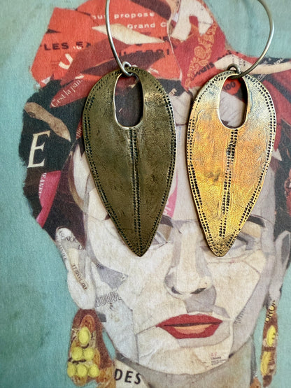 Handmade hammered bronze tribal earrings on pure silver ear wires.