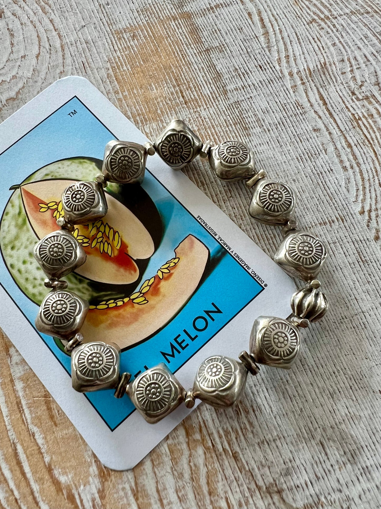 Stamped fine silver flower stretch bracelet.