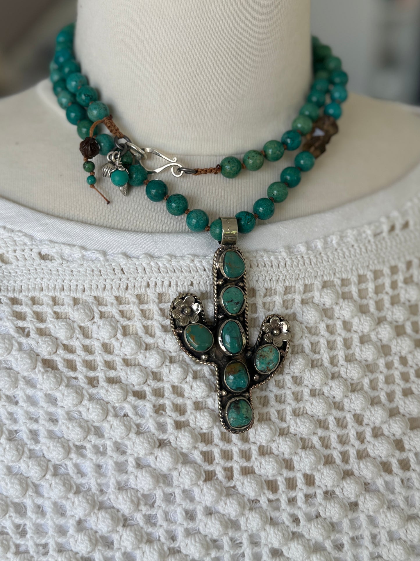 Turquoise cactus pendant necklace on knotted turquoise with smoky quartz and fine silver accents.