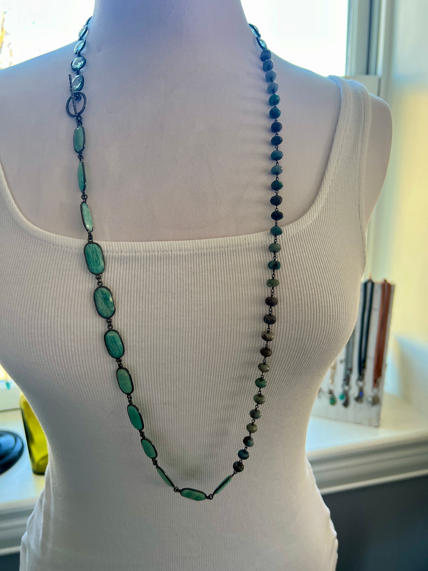 Beautiful aqua mix of green silverite, aqua crystal quartz, and Amazonite stones long necklace. 38”