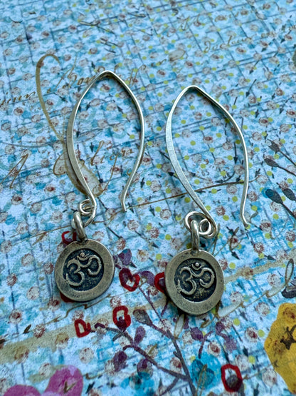 Fine silver ohm earrings on fine silver wires.