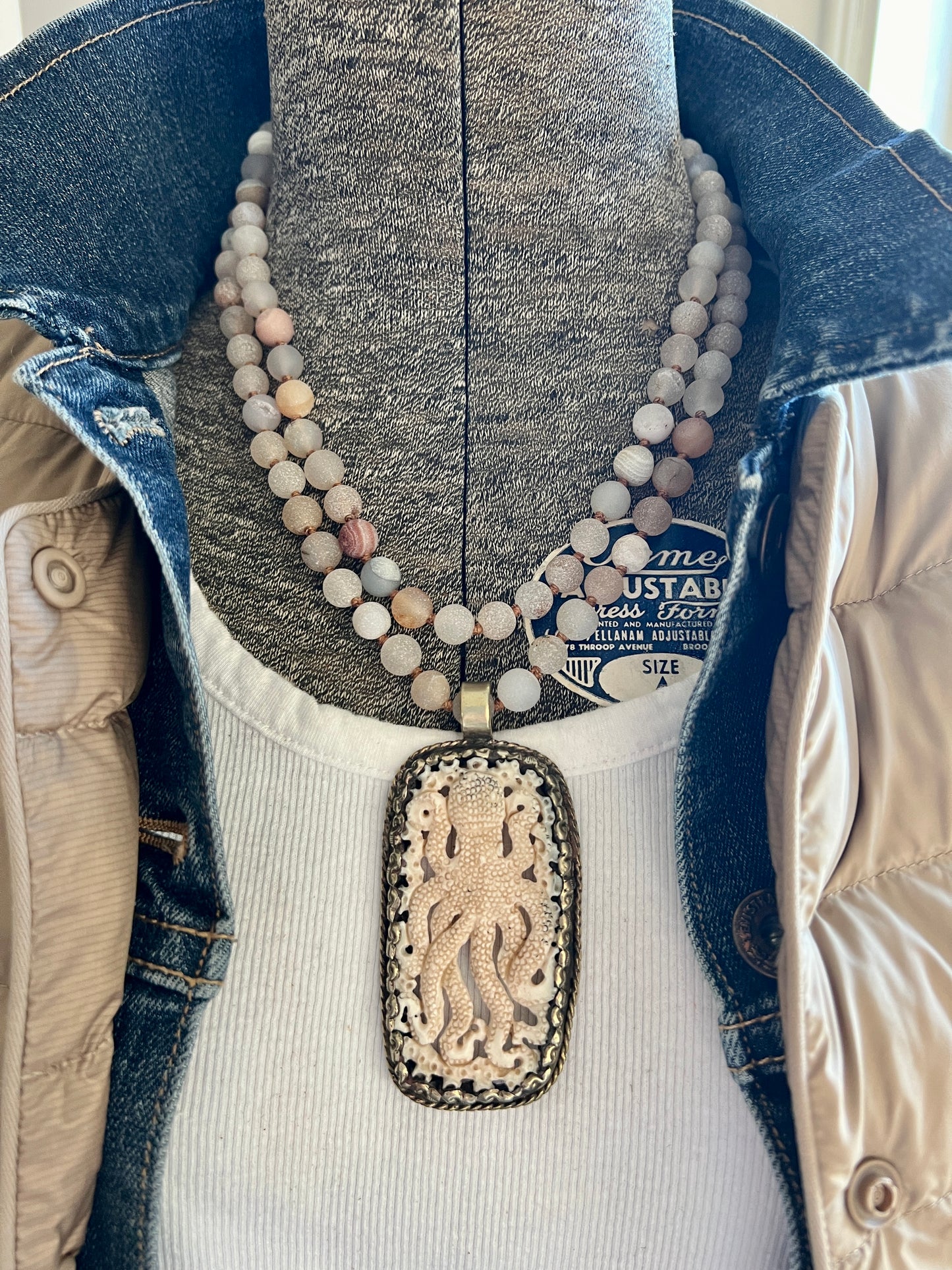 Carved bone octopus on hand-knotted druzy agates.  39” necklace. Wear long or short.