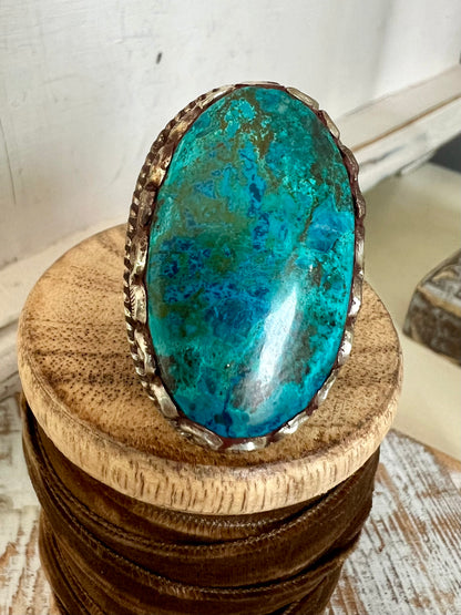 Large turquoise ring with blue and brown veins. Adjustable.