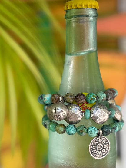 Hammered fine silver pillow coins with turquoise stretch bracelet. 6.5”