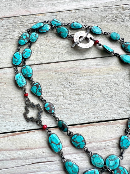 Gorgeous turquoise chain with hand made sterling open cross and toggle. 29”.