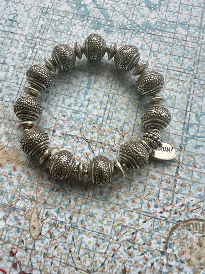 Fun, textured fine silver rounds stretch bracelet. Small (6”)