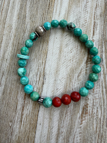 Simplicity in turquoise, fine silver, and broom coral with one trade bead. Stretch bracelet. 6.5”