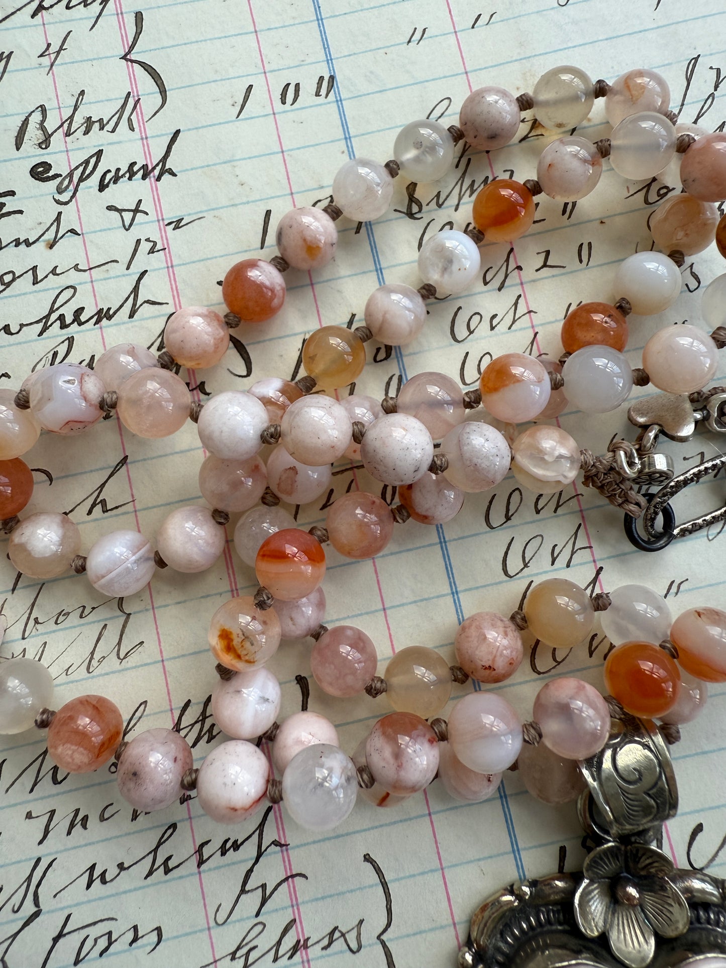 Cherry blossom agates hand knotted necklace with Peruvian Opal Tibetan heart pendant. 32.5-35.5”.